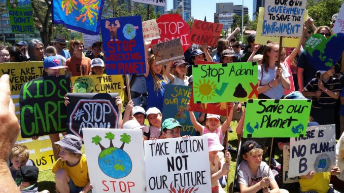 students strike with hand-hold placards