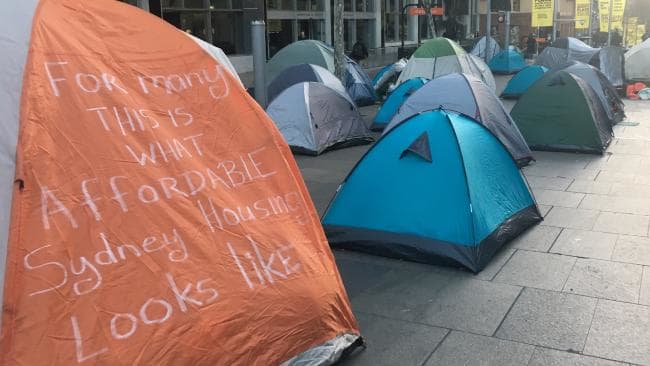 A protest sign at the Martin Place homeless camp from 2017 which says, "For many this is what affordable Sydney housing looks like".