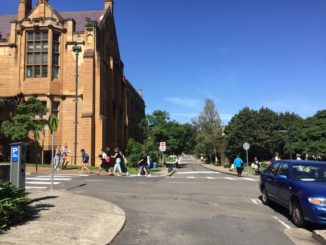 busy students walk through the campus