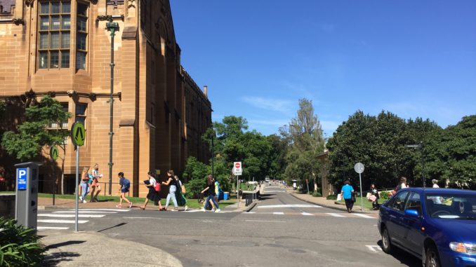 busy students walk through the campus