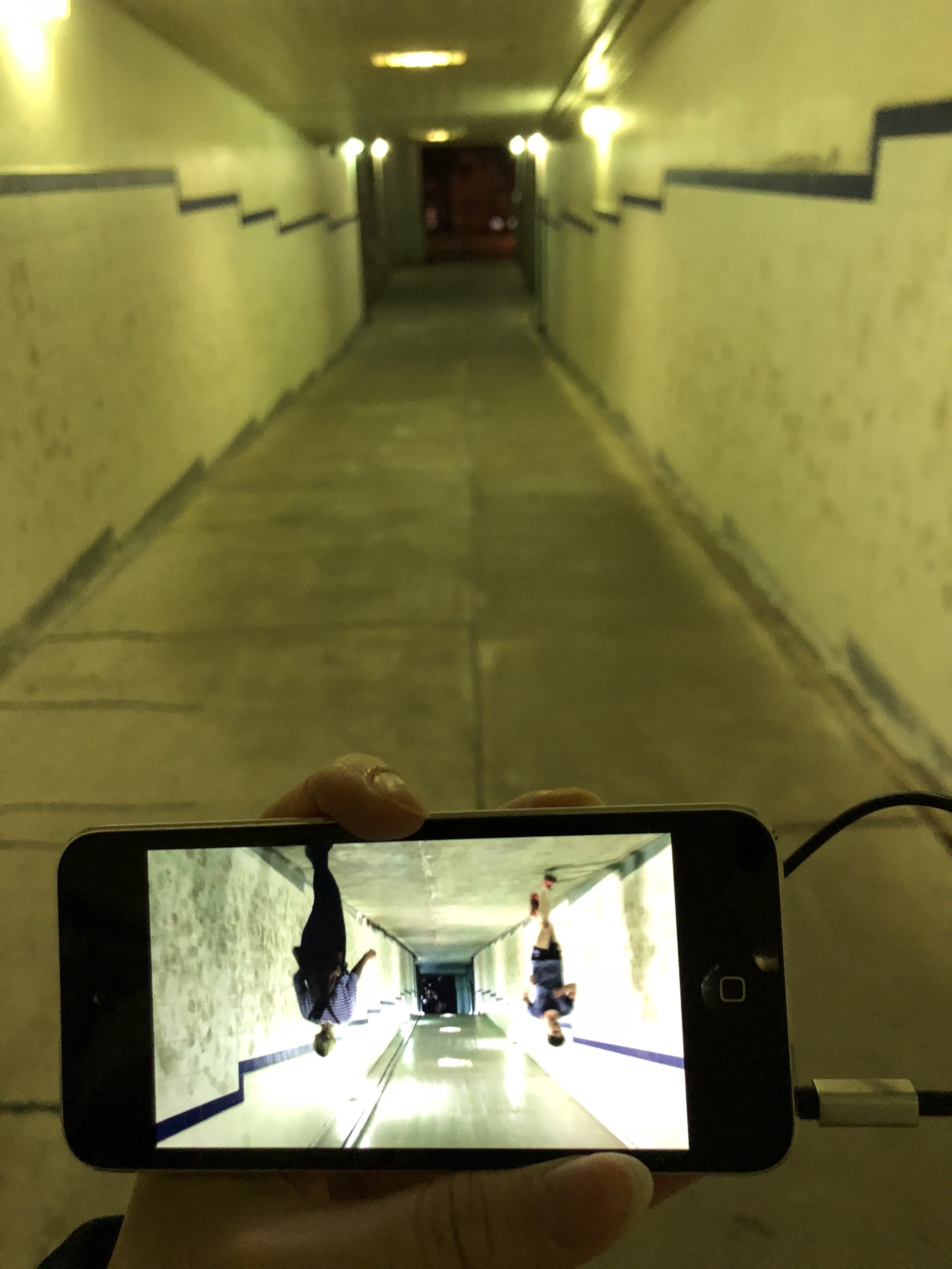 End of path - Bridge Tunnel with various collective footprints on the wall