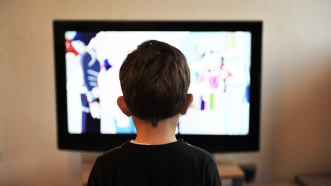 Kid watching tv