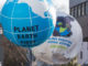 Greenpeace organisation raises big balloons with Planet Earth first message on it