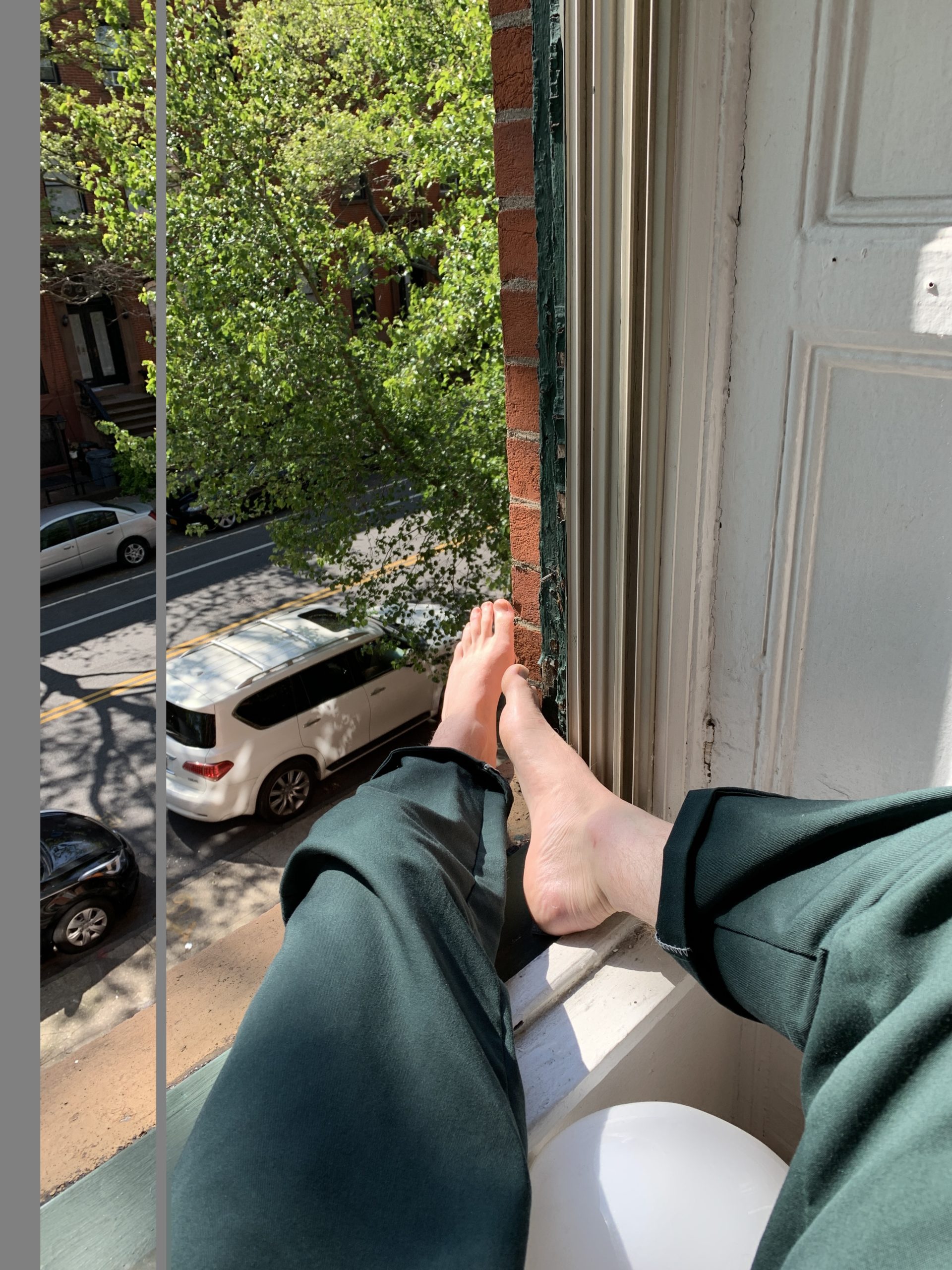 Man sitting on a window sill