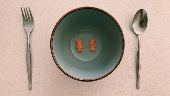 Lollies in a bowl with a spoon and fork